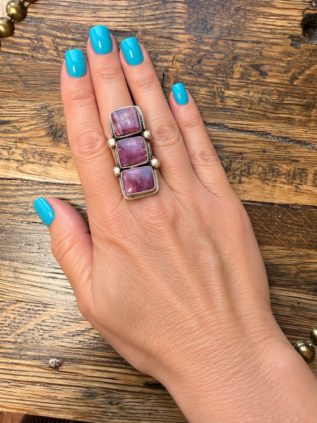 Native American: purple spiny oyster three stone ring $400