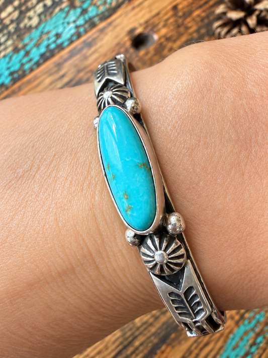 Native American: single stone, long oval, turquoise, and sterling silver bracelet $600